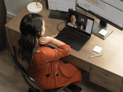 Woman working from home using Microsoft 365 to connect with their team